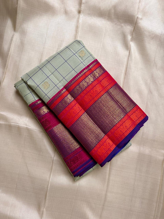 Pastel green pistachio with kungumam red and royal blue border dark blue silk thread checks mayil chakram butta magenta detailed Pallu