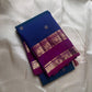 Royal blue Kanchipuram silk saree folded with purple zari woven temple border