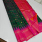 Sarita ✨ – Watermelon Pink Pure Silk Saree
 Pink Body Adorned with Gleaming Zari Buttas
Contrast Purple Thazhampoo Reku Border in Heritage Weave
Emerald Green Accents for a Refreshing, Regal Harmony
Grand Zari Pallu & Contrast Blouse —
