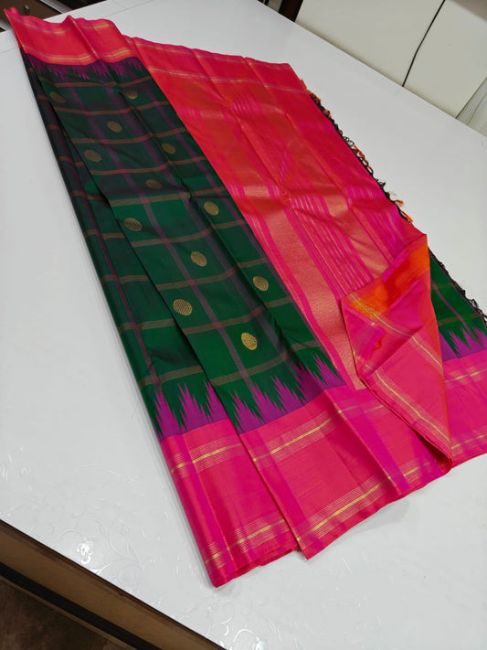 Sarita ✨ – Watermelon Pink Pure Silk Saree
 Pink Body Adorned with Gleaming Zari Buttas
Contrast Purple Thazhampoo Reku Border in Heritage Weave
Emerald Green Accents for a Refreshing, Regal Harmony
Grand Zari Pallu & Contrast Blouse —
