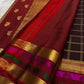 Paaku Brown Pure Silk Kanchipuram Zari Kattam saree draped, showing the dark aubergine-maroon body and Arakku Yaanai border.