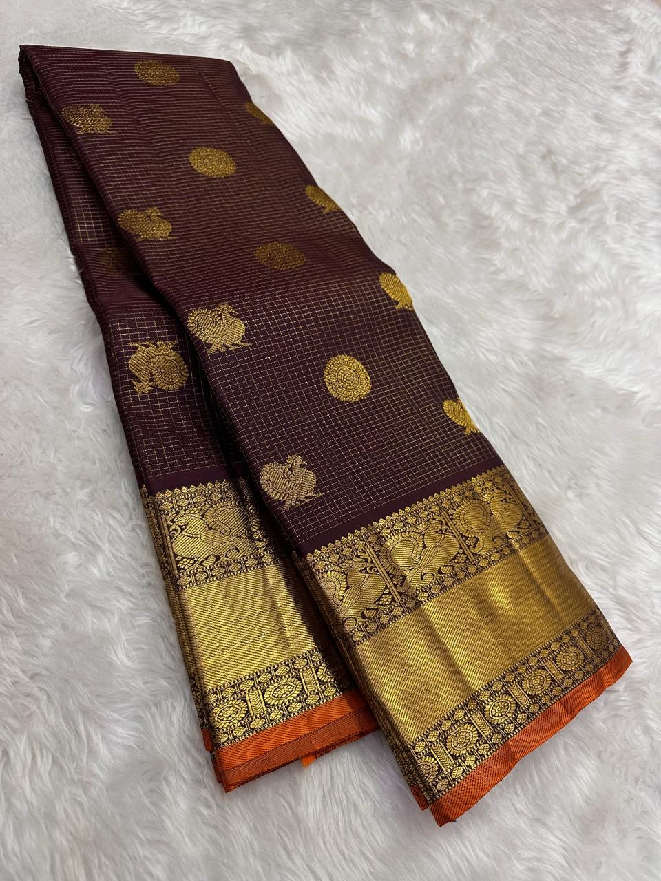 Close view of Mayil Chakram Butta motifs on deep brown Kanchipuram silk saree