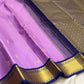 Deep blue korvai border with traditional gold zari on lavender silk saree