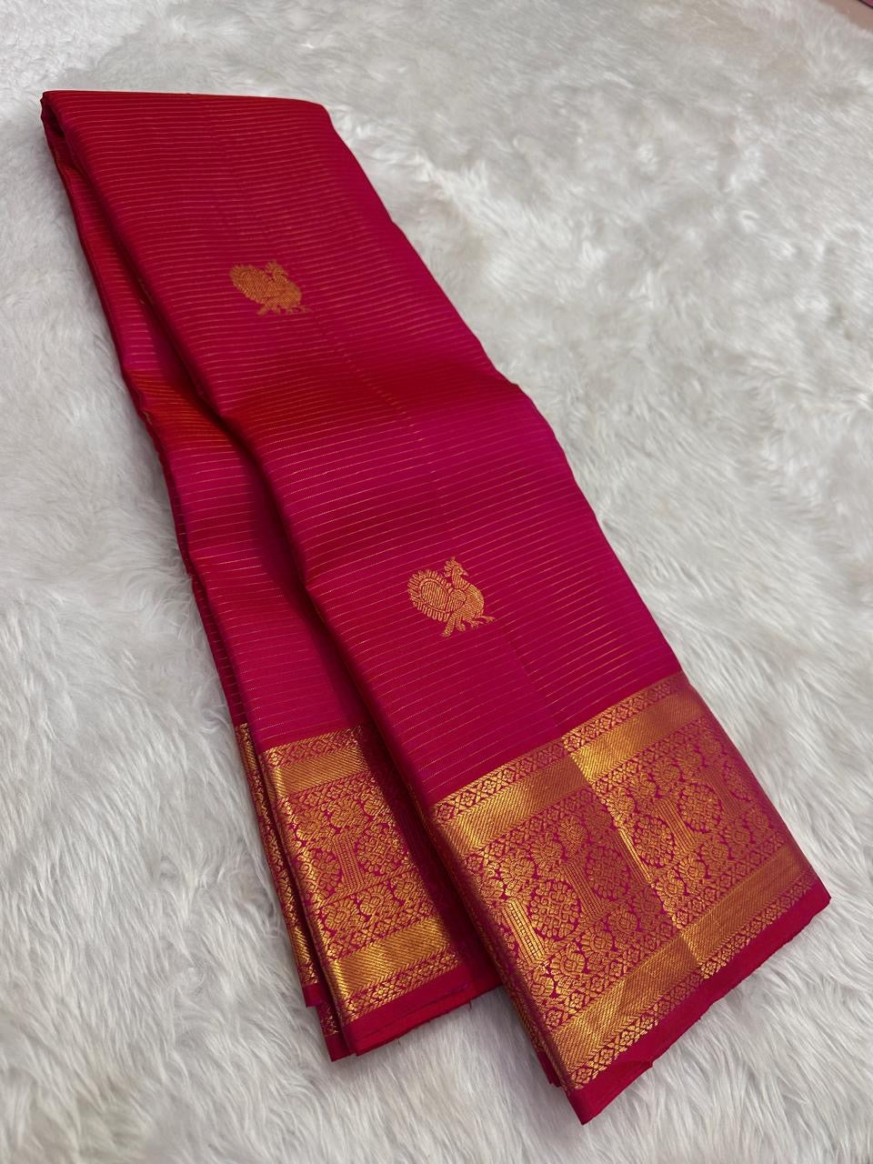 Close view of Mayil Butta motifs on radiant pink Kanchipuram silk saree