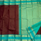 Rich teal pallu detail on deep brown Kanchipuram silk saree