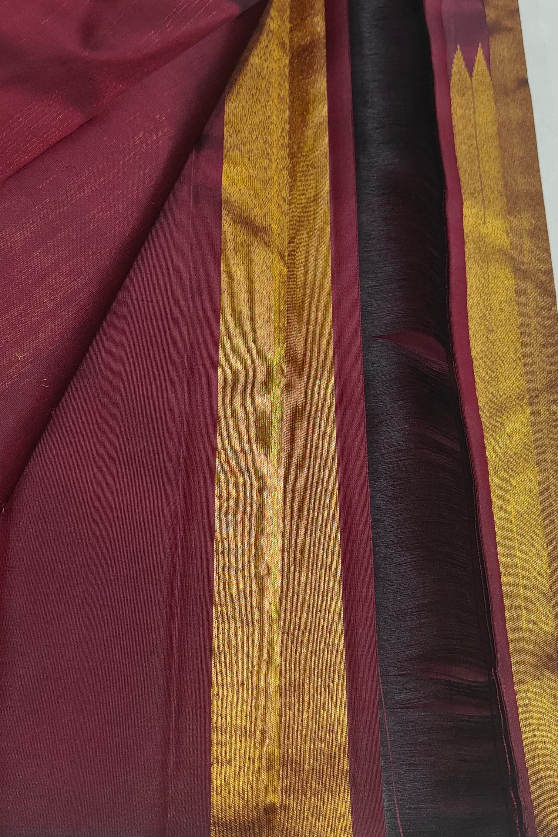 Pure silk Kanchipuram saree in antique gold with deep maroon pallu folded view