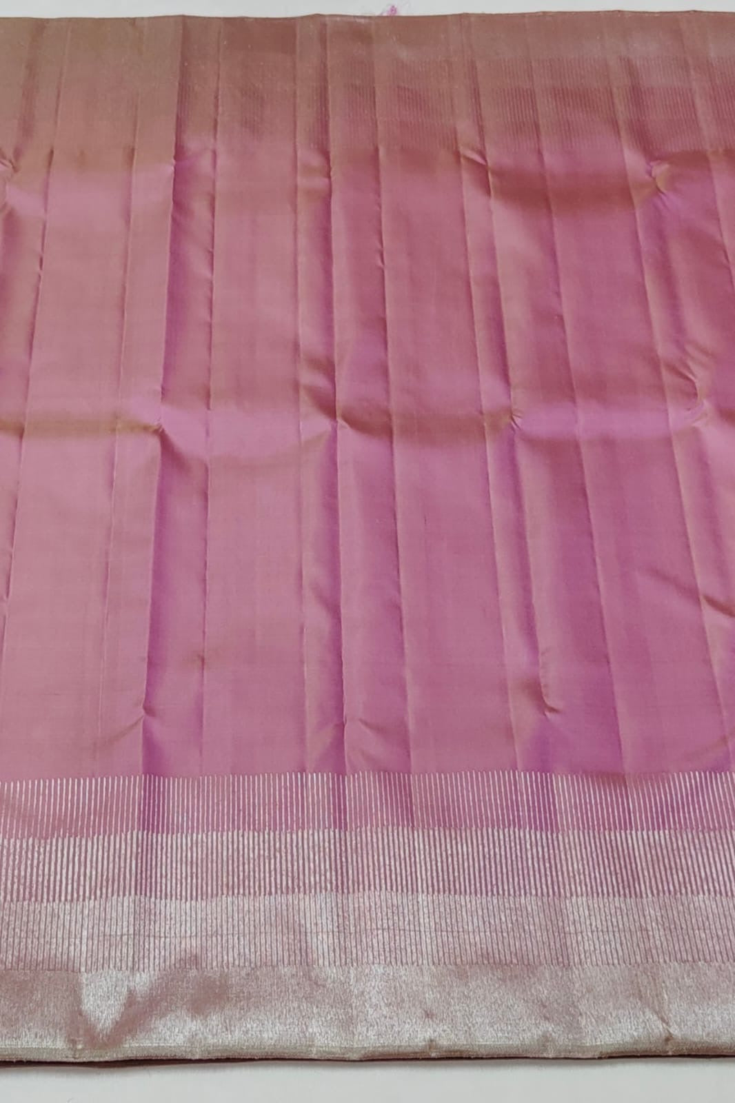 Traditional pink Kanchipuram silk saree with layered classic gold zari border