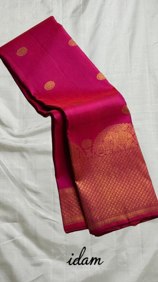 Rosette Bloom — Pure Kanchipuram Silk Saree
Vibrant rani-pink body with copper-rose zari buttas, elephant motifs & floral borders
Silk Mark Certified • Blouse Stitching ($30) • Free Shipping within USA • Ships in Two Weeks