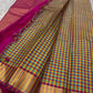 A classic Kanchipuram in Pattani Kattam checks with green, magenta, mustard, and cream.
Finished with a contrast pink border and pallu.
Paisley and chakram motifs in a graceful grid add timeless charm.