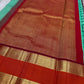 Poomugam Pachai
Pure Silk in Tender Mint & Kumkum Red
Zari-Woven Grandeur in korvai  Contrast