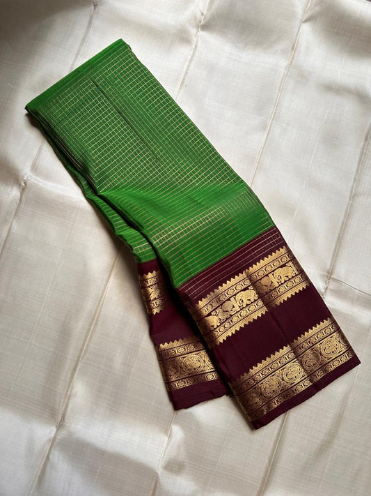 Pure silk kanchipuram with a green zari kattam and a deep coffee brown border rettapet vanasringaram border