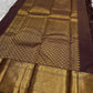 Bronze Lotus Vairaoosi
Coffee-Deep Kanchipuram Silk Saree
Grand Zari Borders • Lotus Butta Elegance