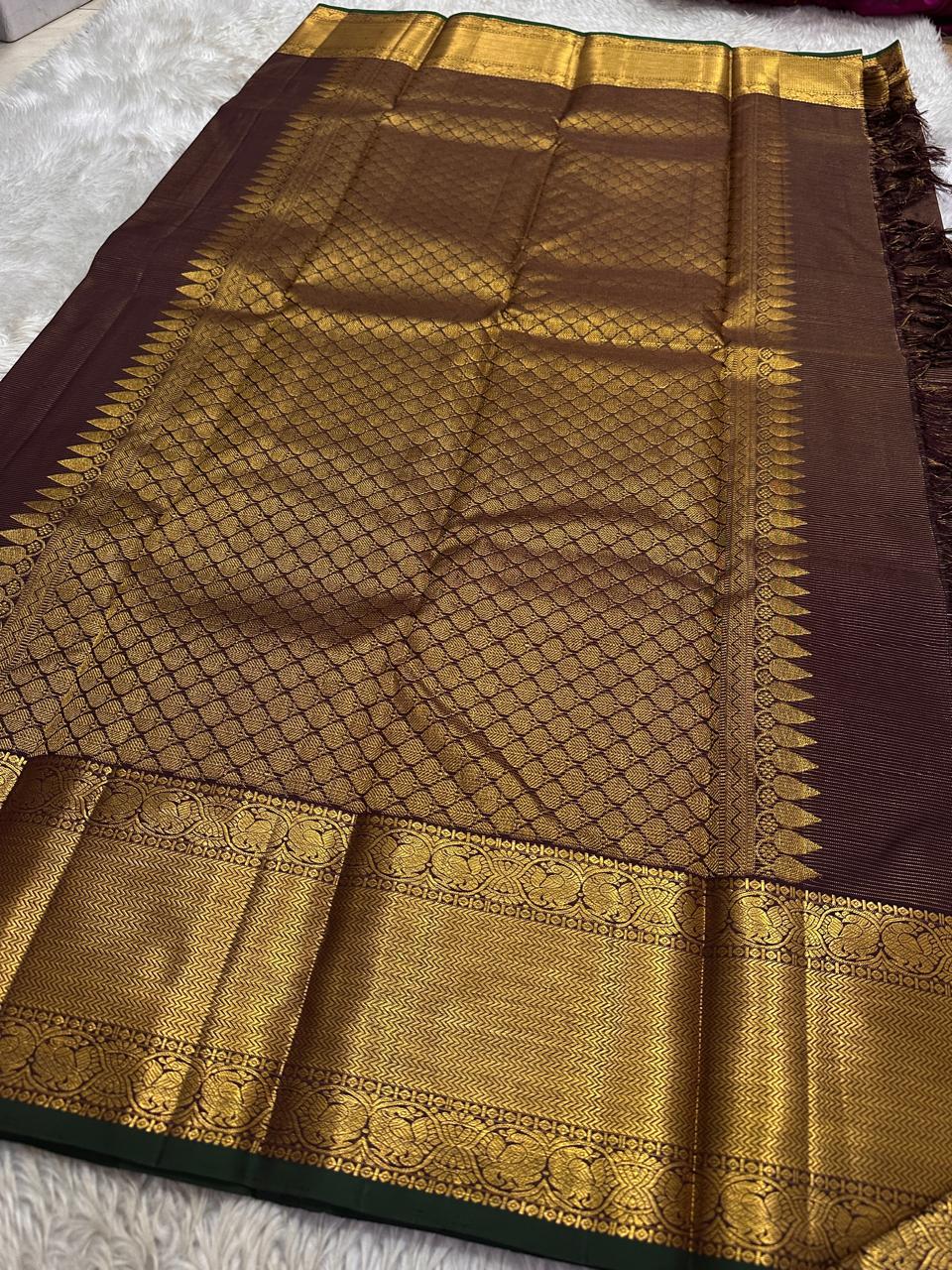 Bronze Lotus Vairaoosi
Coffee-Deep Kanchipuram Silk Saree
Grand Zari Borders • Lotus Butta Elegance