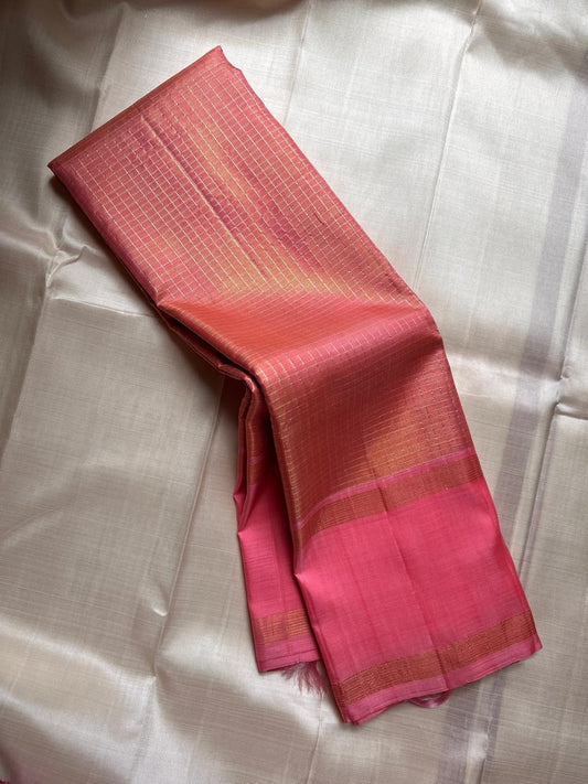 muthyam 🌸✨
Rose Pink & Coral Peach Pure Kanchipuram Silk Saree 💖
Soft Rose Pink Body with Subtle Golden Zari Checks ✨
Coral-Peach Minimalist Borders & Elegant Horizontal Pallu Detailing 🌿
Silk Mark Certified ✅ Lustrous Handwoven saree