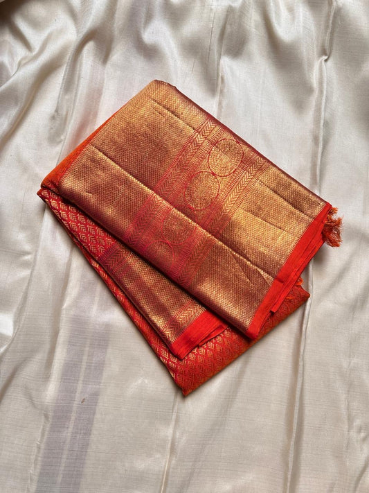 Drenched in a bold, luminous orange, a true showstopper in every way.pure silk and pure Zari 3g Kanchipuram silk saree