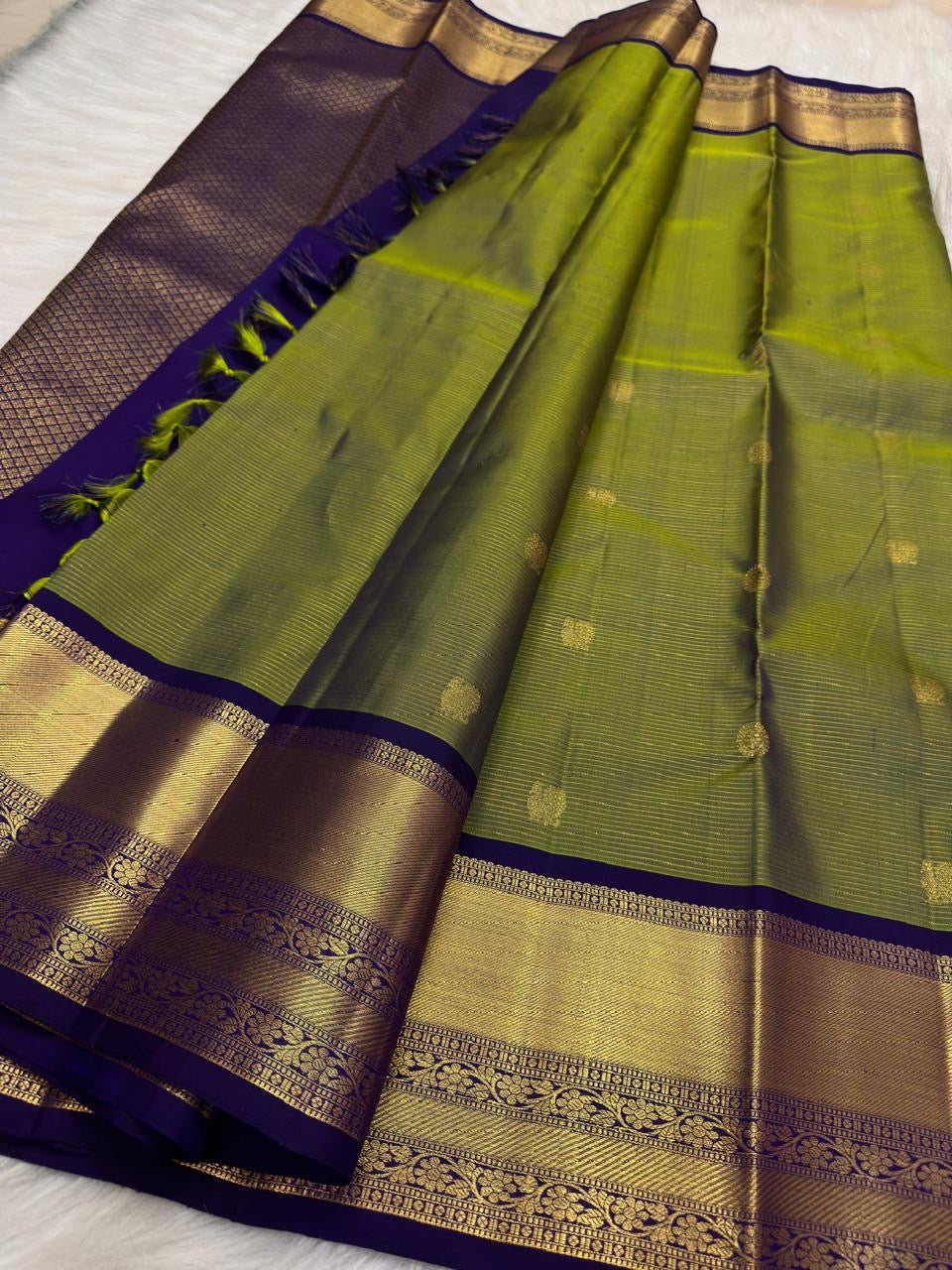 Deep royal purple zari border with floral vine detailing on olive green Kancheepuram Vairaoosi saree