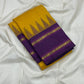 Suvarna Nitya
Mustard–Purple Kanchipuram Silk Saree
Heritage Temple Reku • Gold Zari Borders • Silk Mark Certified