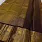 Full view of deep rustic brown with a soft petal pink pallu Kanchipuram saree showing butta placement across the body.