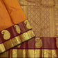 Ushas — Rust Orange Pure Kanchipuram Silk Saree
Radiant Rust Orange Oosi Kattam body with ornate Paisley 2gm Zari ✨
Arakku Red Vanasringaram, Muthuseer & Kamalam border with Fishpettu 
Exquisite Arakku Red diamond-pet grid Zari pallu green selvedge