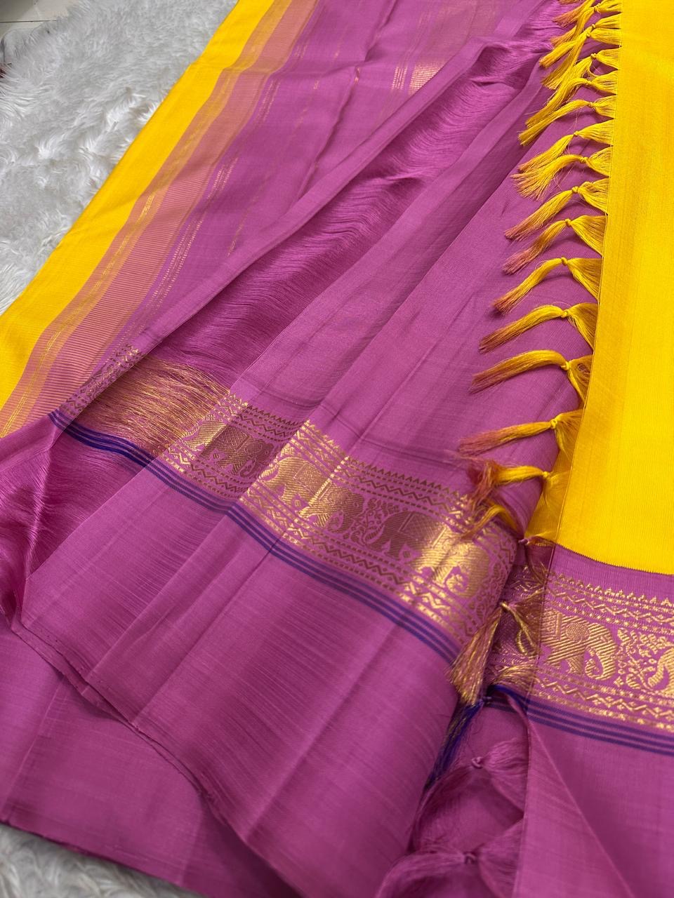 Yellow pure  Kanchipuram Silk Saree with Kaal Erangina pink Zari Border