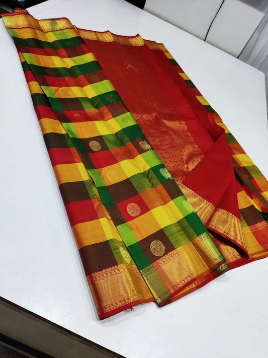 Sunset Mosaic – Paalum Pazhamum – Pure Kanchipuram Silk Saree
Vibrant Multicolored Checks in Yellow, Green, Rust & Maroon
Golden Zari Borders with Traditional Intricate Weaves

Silk Mark Certified, delivery in 2 weeks