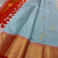 A saree where sky blue melts into sunrise orange—pure silk Kanchipuram magic.