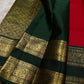 Close-up of deep green zari woven border with elephant and peacock motifs on Kanchipuram silk saree