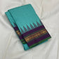 Gopura Neelam — Kanchipuram Pure Silk Saree

 

 

Teal-green body with micro kattam checks for a sleek drape

Regal aubergine korvai border with gopuram/temple motifs & gold zari

Parrot-green selvedge for a fresh, festive pop of contrast

Aubergine pall