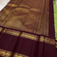 Samprada – Kanchipuram Silk Saree in vibrant cardamom Green & brown
A vibrant parrot green body meets a rich maroon border in this timeless Kanchipuram silk saree