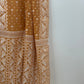 Folded Jamdani saree showing ivory border pattern and subtle gold accents