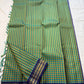 Mayil Pachai Kattam
Pure Kanchipuram Silk Saree – Peacock Green & Mustard Micro Checks
Royal blue korvai borders with gold floral zari detailing
Grand zari pallu with traditional zari weaving
Ships in two weeks free shipping, silk mark certified