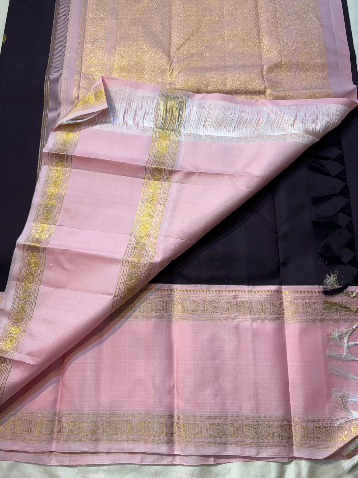 Rose Twilight – Pure Kanchipuram Silk Saree
Pastel Rose-Pink border with Golden Zari Weaves
Deep Plum-Violet Base Scattered with Gold Buttas
French Rose Rettapet Border in Lustrous Zari

Silk Mark Certified, delivery in 2 weeks