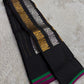 Lavanya – Black Handwoven Kanchipuram Silk Saree with Gold & Silver Zari

A timeless black Kanchipuram silk saree with intricate gold and silver zari motifs — Gandaberunda, parrots, elephants, and lotuses — exuding regal elegance.