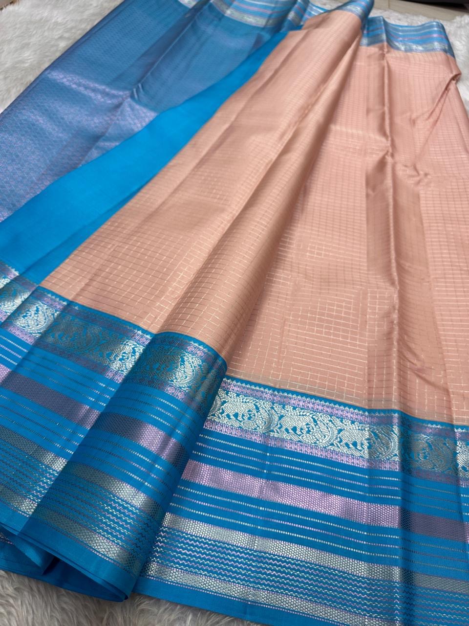 Most unique peach  mocha  and blue combination in pure silk Kanchipuram with Zari kattam and elephant motif border