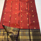 Aruna Mayil – Pure Korvai Kanchipuram Silk Saree

Brick red body with zari rosette buttas

Grand coffee-brown korvai border & pallu with peacock panels, medallions & temple teeth in rich gold zari

Silk Mark Certified | Blouse Piece Included | Fall & Pico