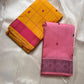 Full view of paisley pallu field with wide dark border on a pink pure Kanchipuram silk saree laid on a rug