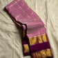 Mauve Mayil Mukham — Kanchipuram Pure Silk

Pastel-mauve pink  body with delicate zari wide kattam checks

Deep plum korvai border with grand mayil (peacock) chakram motifs

Copper-rose chevron zari pallu & plum contrast blouse

Silk Mark Certified • Free