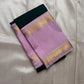 Deep green Kanchipuram silk saree with lavender zari border folded flat lay