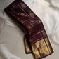 Handwoven Kanjeevaram silk saree featuring deep espresso brown body and Gandaberunda zari weaving