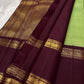 Samprada – Kanchipuram Silk Saree in vibrant cardamom Green & brown
A vibrant parrot green body meets a rich maroon border in this timeless Kanchipuram silk saree