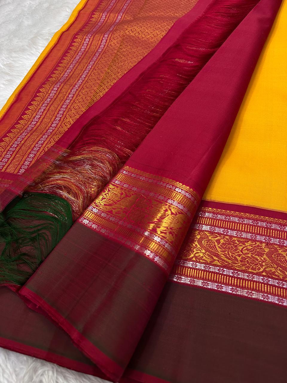 Sundaram - Bathed in the golden glow of ripe mangoes, this mambazham yellow silk saree features graceful vertical veldari stripes and delicate Sonarupa zari work. Woven with nature-inspired bird and foliage motifs