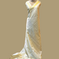 Minimal yet majestic, this ivory-beige silk saree is a celebration of simplicity and sophistication. The body is plain and luminous,  texture of the silk shines through. golden zari border with a sharp, zigzag temple-inspired pattern - perfect for Onam