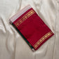 Ivory saree with fine red kattam checks and maroon zari border folded flat lay