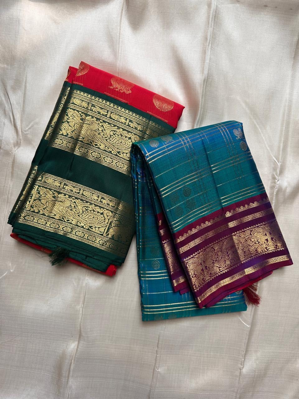 Saree combo photo featuring red-green elephant border saree alongside a blue-purple silk saree
