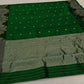 green chanderi silk saree folded lengthwise highlighting zari woven border
