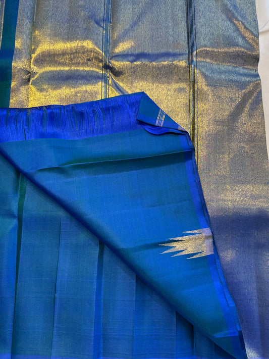Neelam ettukol 
Pure Kanchipuram Silk Saree – Deep Ocean Blue with Silver Zari Ikat Motifs
Rich 8 Kol Weave for Heavier, Denser & Lustrous Drape
Silver Tissue Pallu with Intricate Brocade Weaving
Includes Matching Blue Blouse Piece with Zari Border