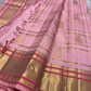 Detailed view of pink Kanchipuram silk saree body with zari checks and peacock motifs near the gold border – Idam Living