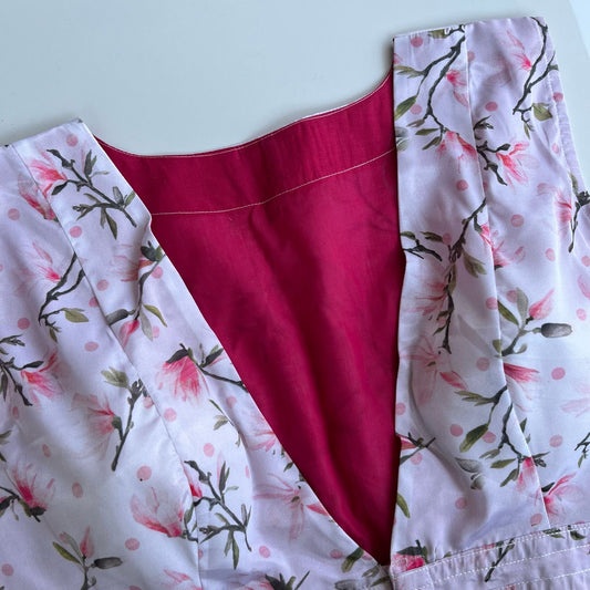 Magnolia printed satin silk sleeveless blouse front view showing print and neckline