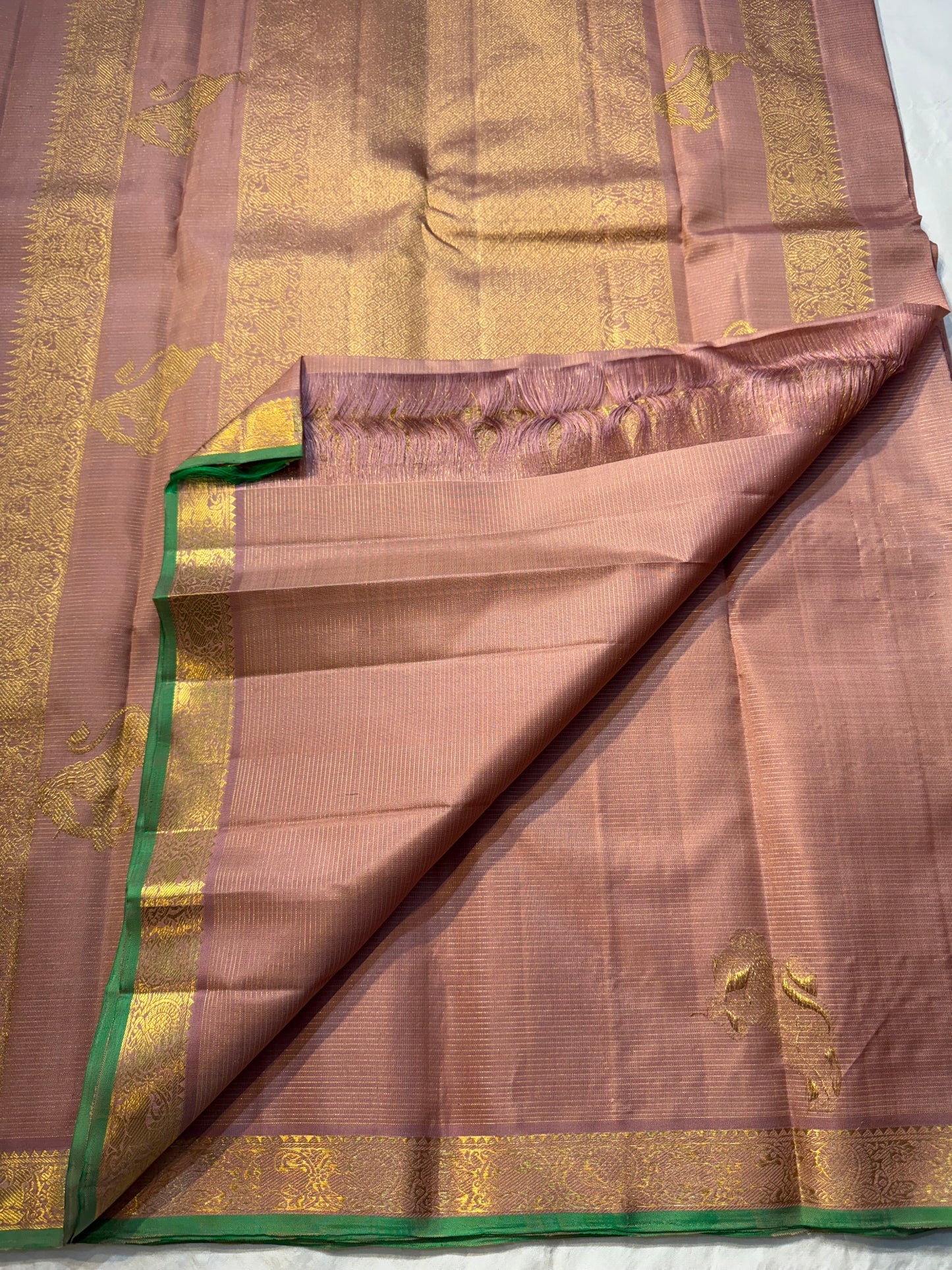 Tamra Yazhi — Pure Kanchipuram Silk vairaoosi with Antique Gold zari  Yazhi Motifs
green-edged traditional brocade border
Silk Mark Certified • Free Shipping within USA • Ships in Two Weeks