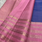 Ramyam, meaning pleasant and delightful, features a mesmerizing blue–purple shot body that shimmers with every movement. Its radiant pink korvai border and pallu, adorned with traditional Varisaipet zari stripes, add festive brilliance.silk mark certified